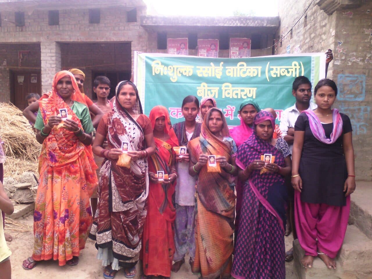 Village women with vegetable seed packets, September 2016