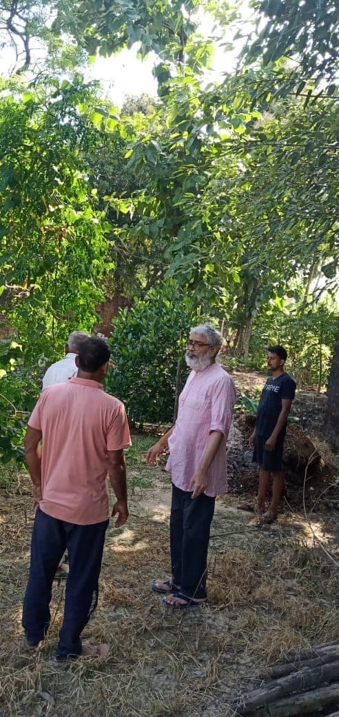 Inspecting fruit trees planted in earlier years, Richhola Tarachand, September 2021