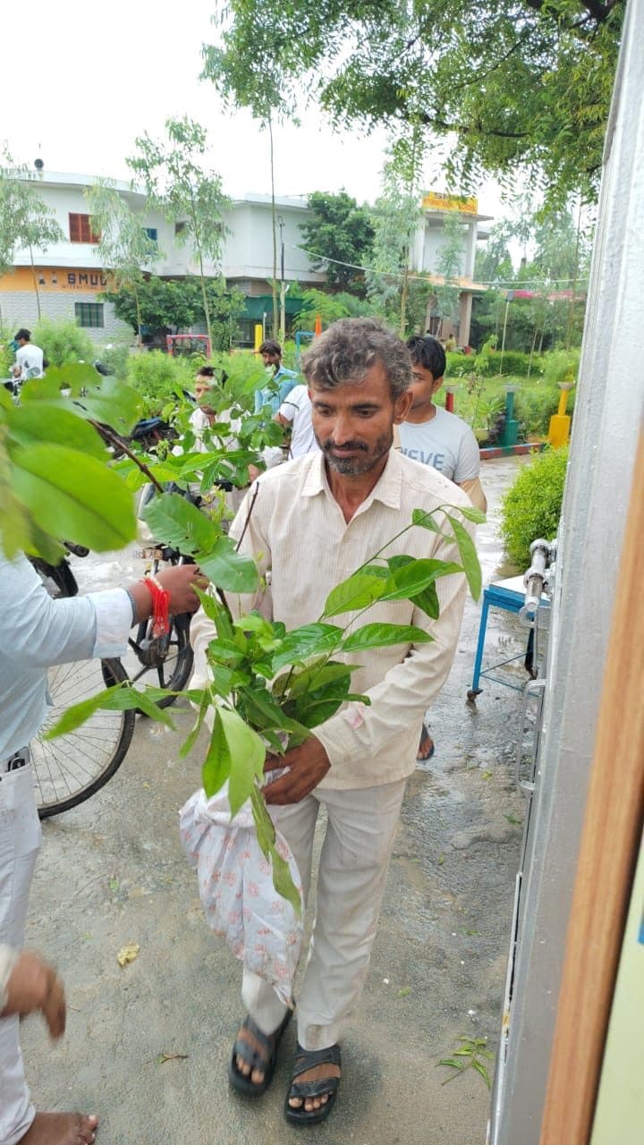 A farmer leaves the Beri camp with his saplings, 6 September 2026