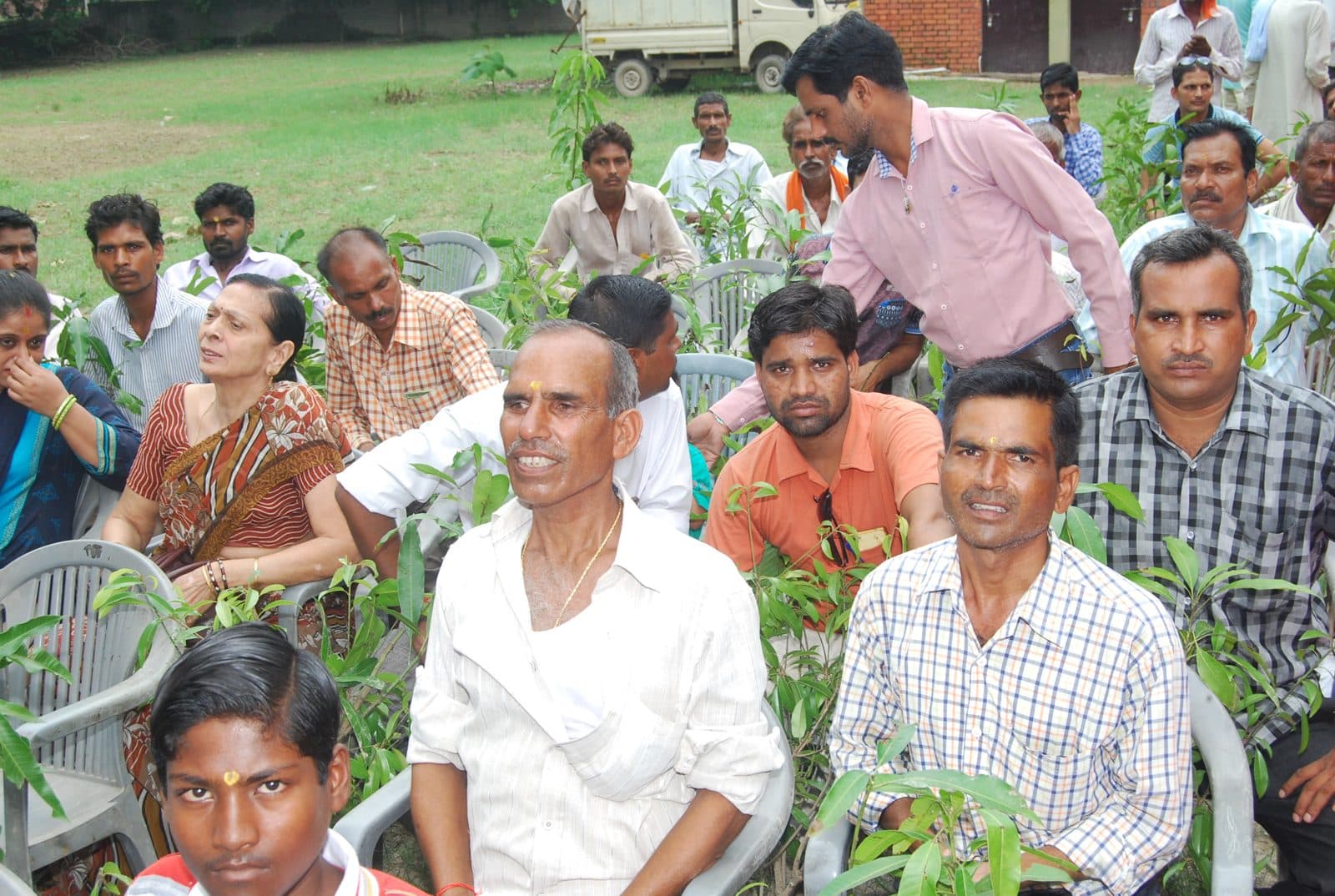 Farmers with fruit saplings at the Silver Law College camp, 2017